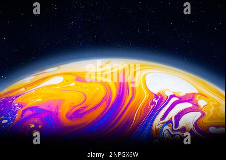 Alien planet in the cosmos, colorful soap bubble film Stock Photo