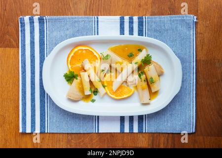Salsify with Vegan Lunch meat and Orange Sauce Stock Photo