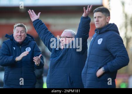 Steve Evans standing on touchline during game whilst manager of Stevenage Football Club with his management team of Paul Raynor and Alex Revell Stock Photo