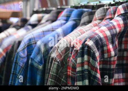 Cloth Hangers with Shirts, Closeup photo of Men, Shirts on Hangers Stock Photo