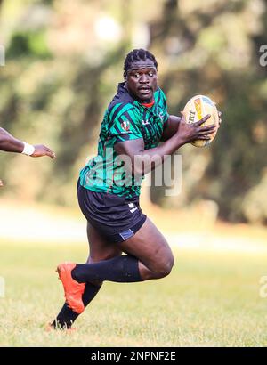 Kenya's Shujaa forward Alvin Otieno (right) charges past teammates during a training session for the HSBC World sevens Rugby series at Ruaraka, KCB Sports Club. Nairobi. Kenya. Stock Photo