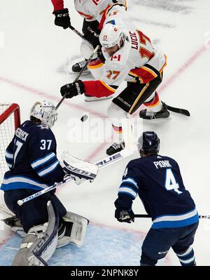 Winnipeg Jets goaltender Connor Hellebuyck (37) protects his net during the  second period of an NHL hockey game against the New Jersey Devils, Sunday,  Feb. 19, 2023, in Newark, N.J. (AP Photo/Frank
