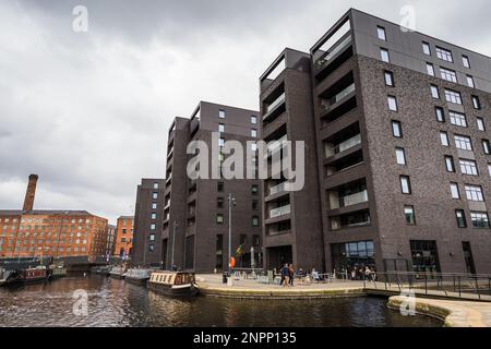 The modern three buildings at Cotton Field Wharf seen towering above New Islington marina in the Rochdale canal seen in February 2023. Stock Photo
