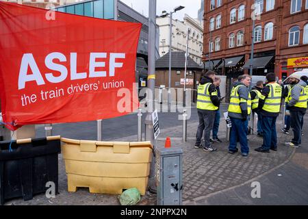 Train drivers from the ASLEF union strike for fair pay outside Grand Central station during a day of co-ordinated strikes with other workers strikes in the UK on 1st February 2023 in Birmingham, United Kingdom. Members of the Associated Society of Locomotive Engineers and Firemen union are striking for fair pay in line with infration. Stock Photo