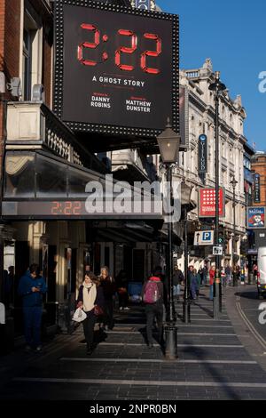 West End theatre show posters for the show 2:22 at the heart of Londons Theatreland on 8th February 2023 in London, United Kingdom. West End theatre is mainstream professional theatre staged in the large theatres in and near the West End of London, which has also been nicknamed Theatreland. West End theatre is usually considered to represent the highest level of commercial theatre. Stock Photo