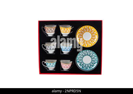 Turkish coffee cup set boxed. Pieces Turkish coffee cup and saucer set in a red box isolated on white background. Stock Photo