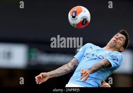 Manchester City's Joao Cancelo heads the ball during the Champions