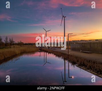 Colourful sunset afterglow reflections in Father Collins Park Stock Photo