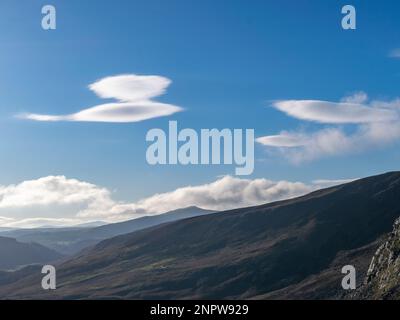 Lenticular clouds over Wicklow Mountains. Stock Photo