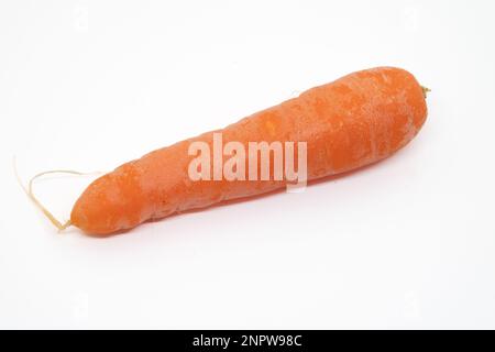 Raw carrots isolated on a white background Stock Photo