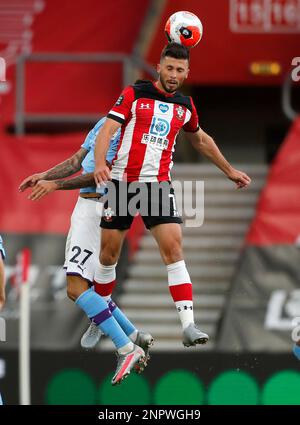 Manchester City's Joao Cancelo heads the ball during the Champions