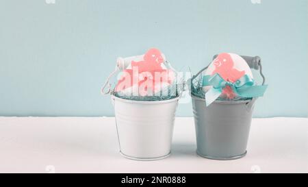Easter decor with selective focus. Holiday still life with decorative eggs in a buckets with copy space for text Stock Photo