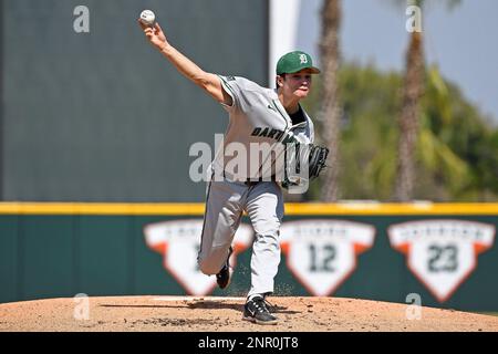 CORAL GABLES, FL - FEB 26: Miami outfielder Dario Gomez (22) runs to first  base after hitting a single in the third inning as the Miami Hurricanes  faced the Dartmouth Big Green