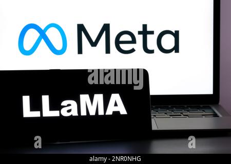 LLaMA letters seen on smartphone and blurred Meta company logo on background. LLaMa is Large Language Model Meta AI from Meta Platforms. Stafford, UK, Stock Photo
