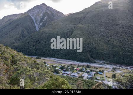 Arthurs pass village in a mountain valley in the Southern Alps of New Zealand seen from above. Stock Photo