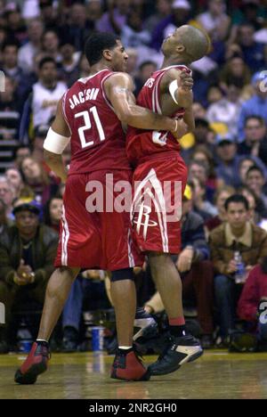 Jim Jackson (left) and Steve Francis of the Houston Rockets celebrate during 99-87 victory over the Los Angeles Lakers in an NBA basketball game at the Staples Center, Thursday, Dec. 25, 2003, in Los Angeles. (Kirby Lee via AP)