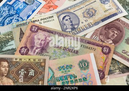 Old assorted foreign paper currency banknotes. Stock Photo