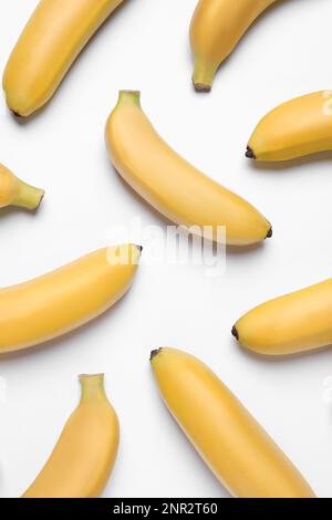 Sweet ripe baby bananas on white background, top view Stock Photo