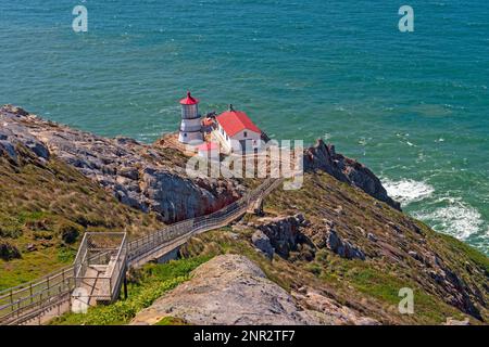 Historic Lighthouse on a Rocky Shore at Point Reyes National Seashore in California Stock Photo