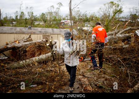 first lady maria lee helps clean up evelyn leamons home at auburn hills mobile home park on thursday april 23 2020 in ooltewah tenn auburn hills mobile home park was hit hard during the easter tornado lee other elected officials and the samaritans purse helped to clean up leamons home cb schmelterchattanooga times free press via ap 2nr2wdg