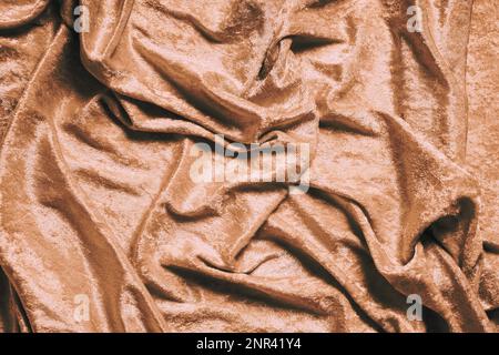 gold or copper colored luxury panne velvet drape background texture Stock Photo