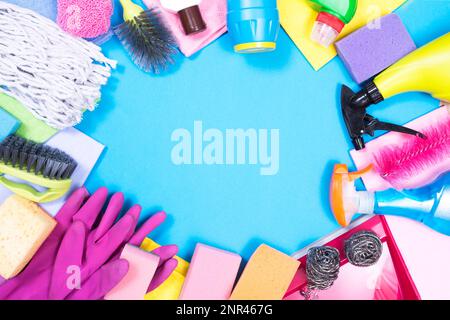 Detergents and cleaning accessories on a green background. Housekeeping  concept Stock Photo - Alamy