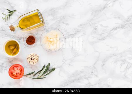 various ingredients with oil white marble background. High resolution photo Stock Photo