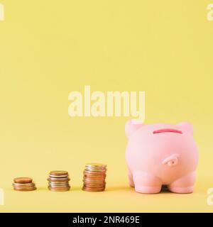 piggy bank with stacks coins. High resolution photo Stock Photo