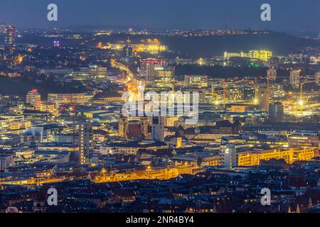 City view at night, old town with collegiate church, castle square and main station, Stuttgart, Baden-Wuerttemberg, Germany Stock Photo
