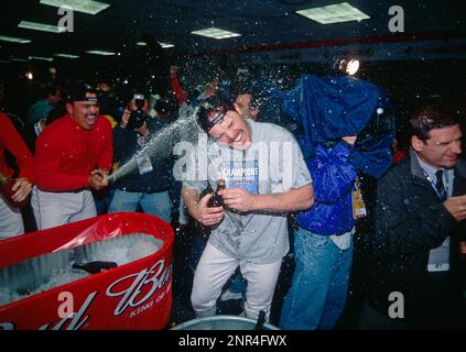 27 Oct. 2002: Anaheim Angels shortstop David Eckstein (22) and designated  hitter Shawn Wooten (44) kiss the World Series trophy in the clubhouse  after the Angels defeated the San Francisco Giants 4