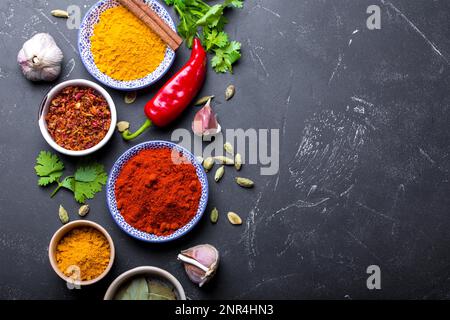 Set of Indian food cooking ingredients. Traditional Indian assorted spices and herbs. Curry, turmeric, cardamom, garlic, pepper, cilantro, cinnamon. P Stock Photo