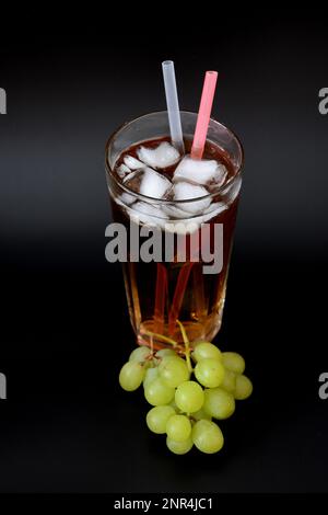 A bunch of mixed grapes on black background Stock Photo - Alamy