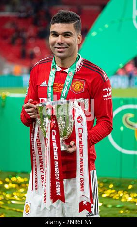 London, UK. 27th Feb, 2023. Manchester United's Casemiro celebrates with the trophy after the awarding ceremony for the Football League Cup Final match between Manchester United and Newcastle United in London, Britain, on Feb. 26, 2023. Credit: Xinhua/Alamy Live News Stock Photo