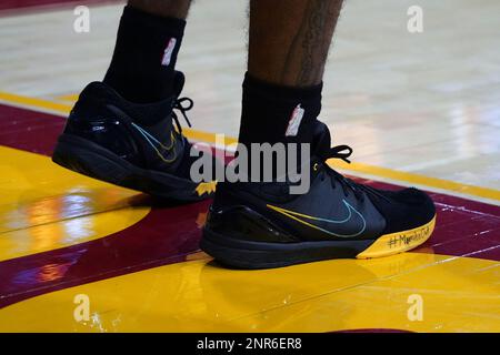 Detailed the black and yellow Nike worn by Southern California Trojans guard Daniel