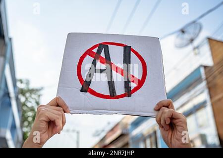Demonstrator holding "No AI" placard Stock Photo