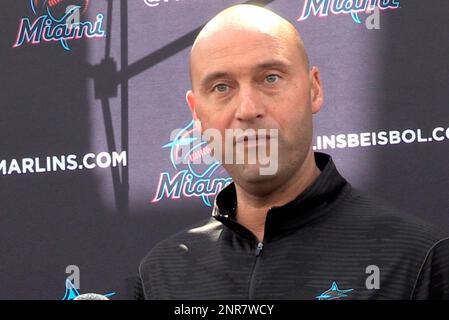 Miami Marlins baseball team CEO Derek Jeter, center, speaks to members of  the media inside Marlins Park stadium, Monday, Feb. 11, 2019, in Miami.  Jeter is entering his second season as CEO