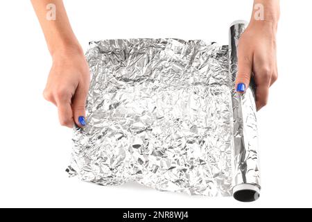 Female hands with roll of aluminium foil on white background, closeup Stock Photo