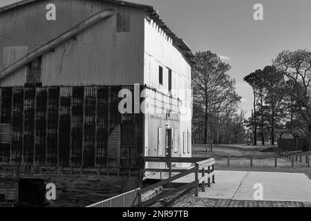 Black and white image of an abandoned rural grain mill. Stock Photo