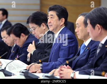 Japan's Prime Minister Shinzo Abe (C) and Minister of Health Katsunobu Kato (3rd from L) attend a meeting of New Coronavirus Infectious Disease Headquarters (task force) at the prime minister's office in Tokyo on February 13, 2020. The number of the patients who have been infected with a new coronavirus COVID-19 has reached to 48,206 and the death toll has been confirmed 1,310 so far as of February 13th in China. As the outbreak continues to spread outside China, the World Health Organization (WHO) declared the new coronavirus a Global Health Emergency on Jan 31st. ( The Yomiuri Shimbun via AP