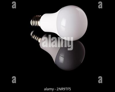 LED light bulb with reflection isolated on a black background Stock Photo