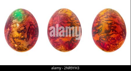 Collection of abstract orange - brown - green drawings on painted eggs. Easter concept, fantasy animal eggs. Copy space Stock Photo
