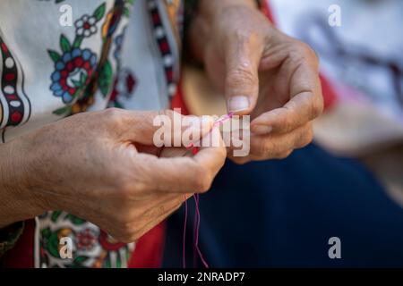 woman hand and white thread crochet Stock Photo