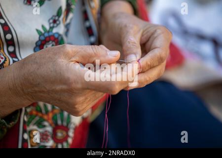 woman hand and white thread crochet Stock Photo