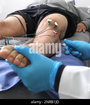 Electromyography EMG and Somatosensory Evoked Potential PEV of lower extremities, neurophysiological test applies electrical stimuli near the nerves Stock Photo