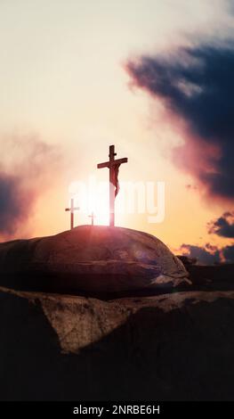 Passion of Jesus Christ on the hill of Golgotha and the cross symbol of death and resurrection Stock Photo