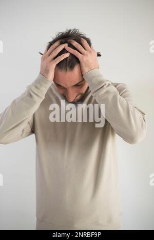Stressed man head in hands Stock Photo