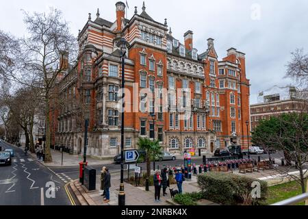 London, UK - February 12, 2023: Busy afternoon at Trafalgar square. Locals and tourists visiting the square and the National gallery Stock Photo