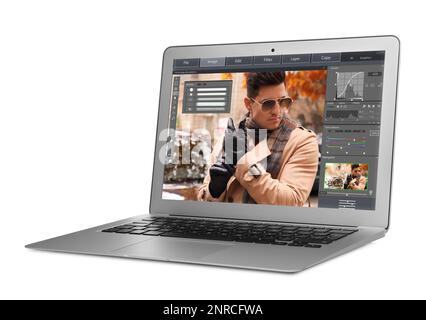 Laptop with photo editor application isolated on white Stock Photo