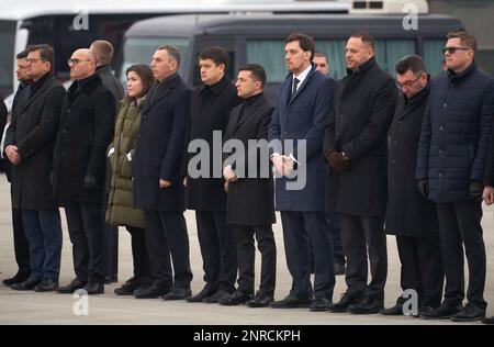 In this photo provided by the Ukrainian Presidential Press Office, Ukrainian President Volodymyr Zelenskiy, centre, and Ukraine's Prime Minister Oleksiy Honcharuk, centre right, seen before a memorial ceremony at Borispil international airport outside Kyiv, Ukraine, Sunday, Jan. 19, 2020. An Ukrainian passenger jet carrying 176 people has crashed just minutes after taking off from the Iranian capital's main airport on Jan. 8, 2020. (Ukrainian Presidential Press Office via AP)