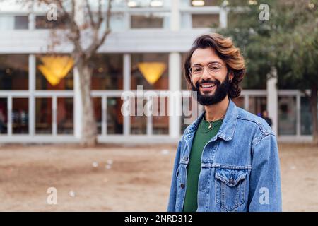 man with beard smiling looking at camera Stock Photo